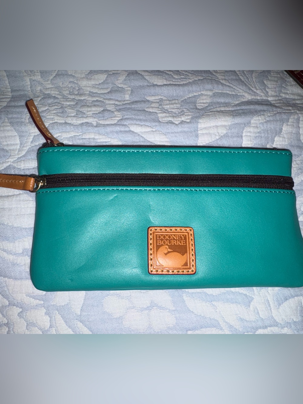 Dooney & Bourke Teal Jade Wexford Leather Pouch with Tan Trim